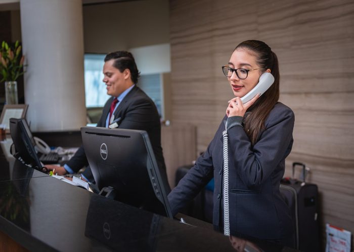 receptionists, phone call, hotel, reception, woman, man, work, attention, lobby, employees, professional, company, assistance, hotel, hotel, hotel, hotel, hotel, reception