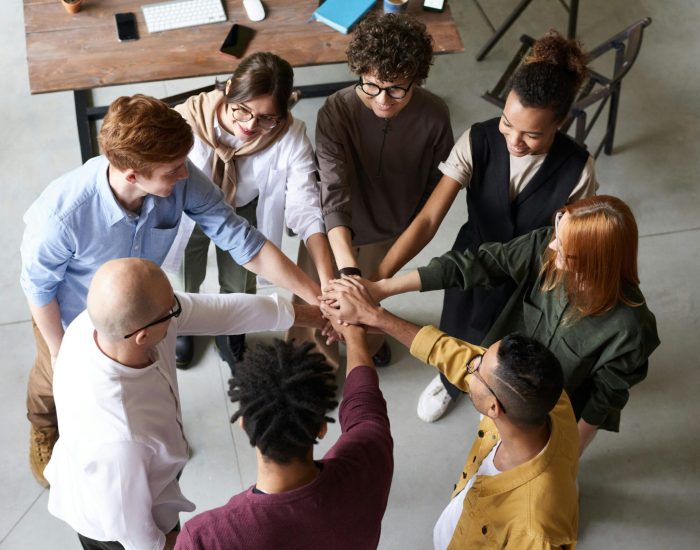 Top view of diverse group of people collaborating in office setting.